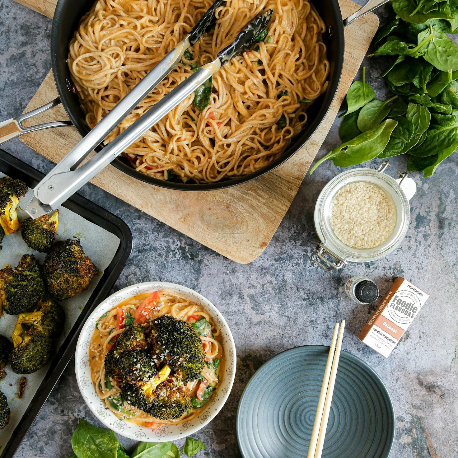 Diverse group of community members sharing a meal together, showcasing the social bonds formed through collaborative cooking